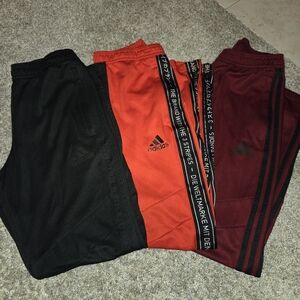 Adidas Kids Sweatpants Zippers - Black, Red, and Maroon. Gently worn. Youth L.